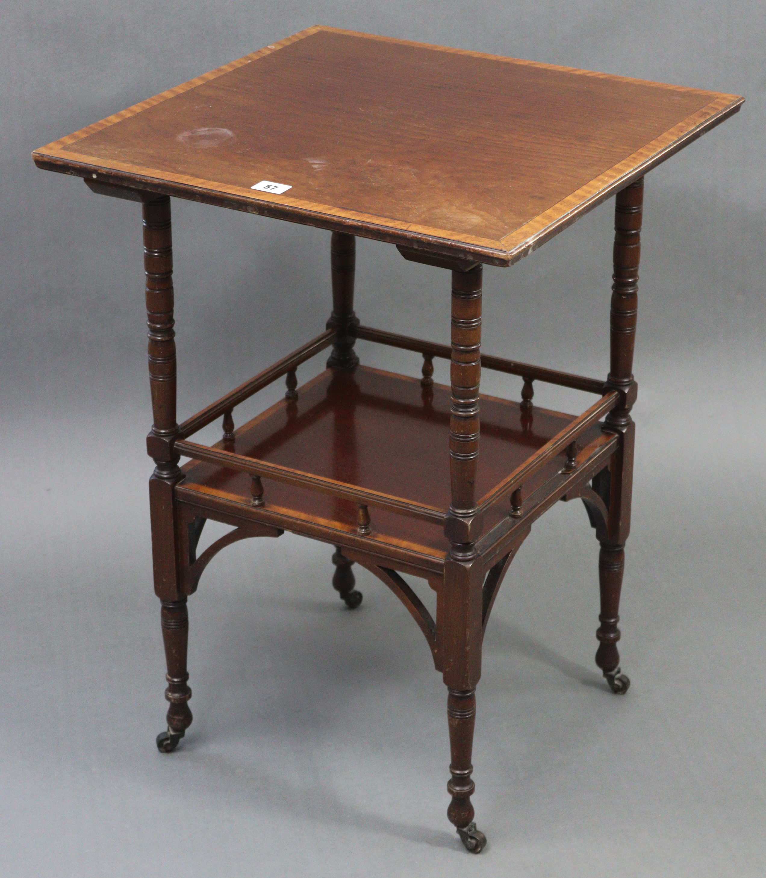 A late Victorian mahogany cross-banded square two-tier occasional table on turned supports with