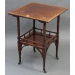 A late Victorian mahogany cross-banded square two-tier occasional table on turned supports with