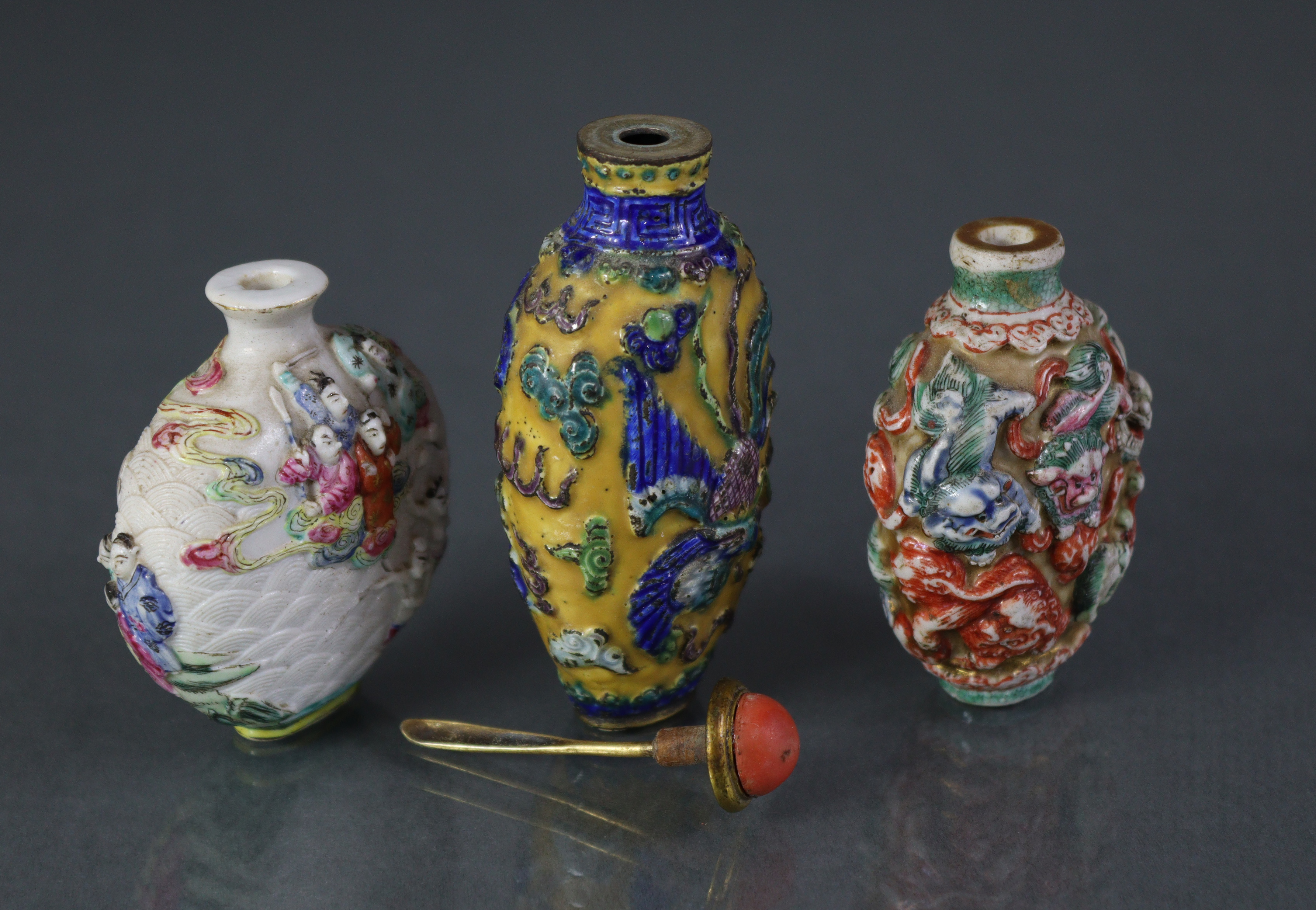 Three Chinese moulded porcelain snuff bottles, the largest decorated with a dragon & phoenix in - Image 3 of 5