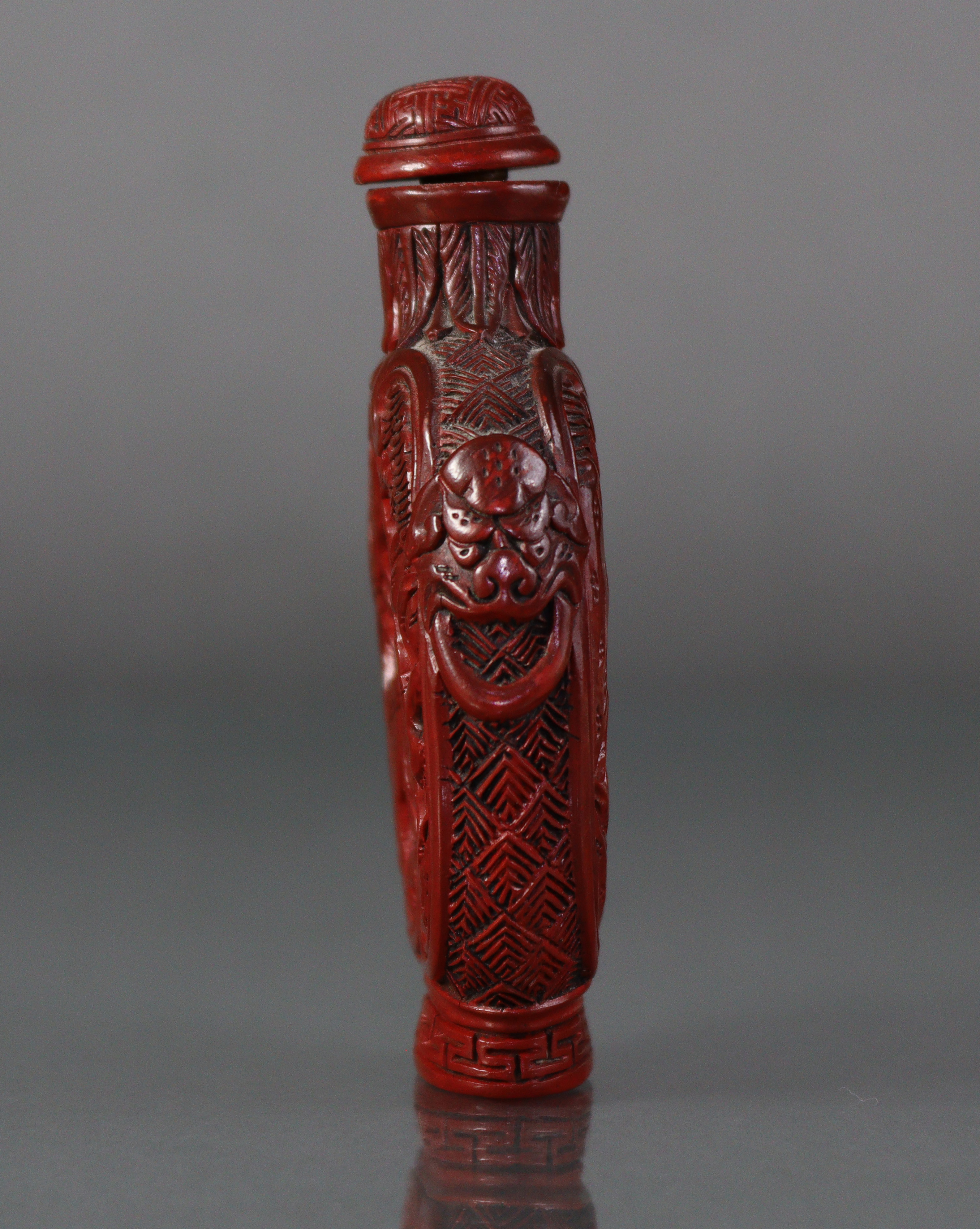 A Chinese cinnabar lacquer large snuff bottle of ovoid form, with flat sides, each carved with a - Image 2 of 7