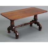 A late Victorian mahogany low occasional table with rounded corners to the plain rectangular top, on