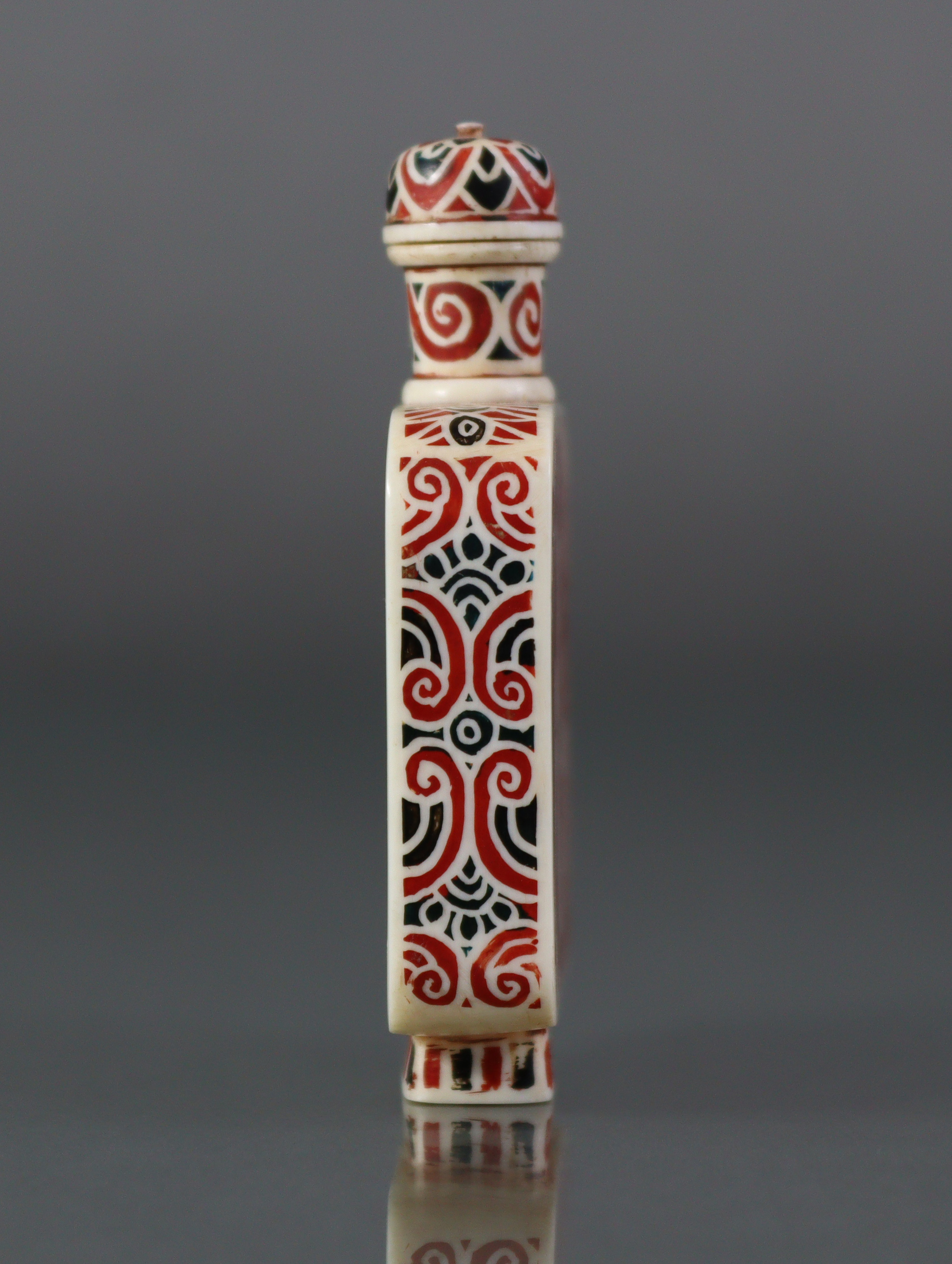 A Chinese stained ivory snuff bottle of flat-sided rectangular form, each side decorated with - Image 4 of 6