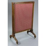 An early Victorian carved rosewood extendable fire screen inset floral silk damask, each side with