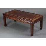 A Chinese hardwood low rectangular occasional table with moulded edge, on square legs, 40” wide x