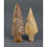 Two Neolithic flint spear heads, 3?” & 3¾” long (the larger missing tip).