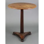 A William IV mahogany tripod table with circular tilt-top, on tapered hexagonal column & triform