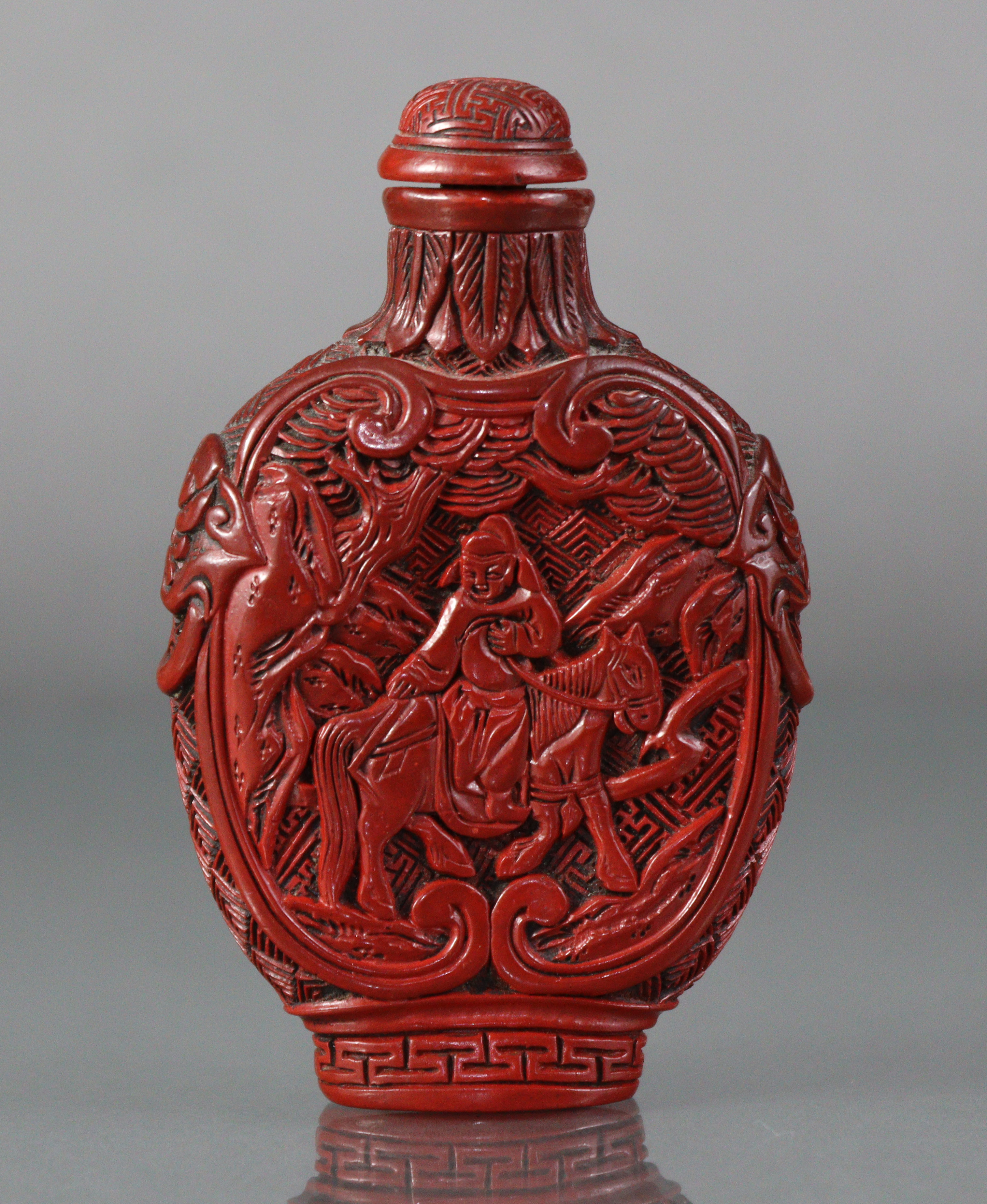 A Chinese cinnabar lacquer large snuff bottle of ovoid form, with flat sides, each carved with a