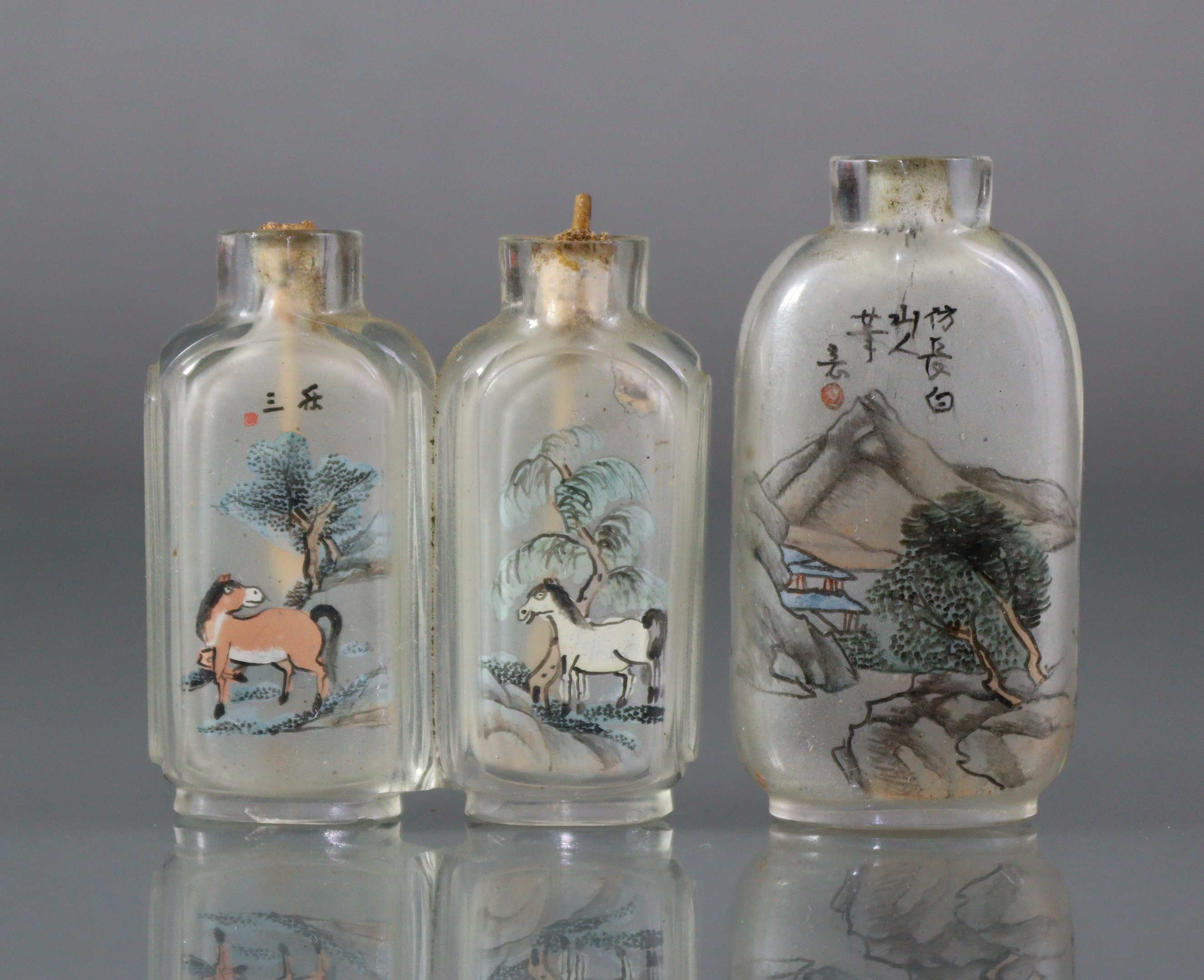 Two Chinese inside-painted glass snuff bottles, the larger 2¼” bottle of rounded rectangular form,