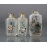 Two Chinese inside-painted glass snuff bottles, the larger 2¼” bottle of rounded rectangular form,