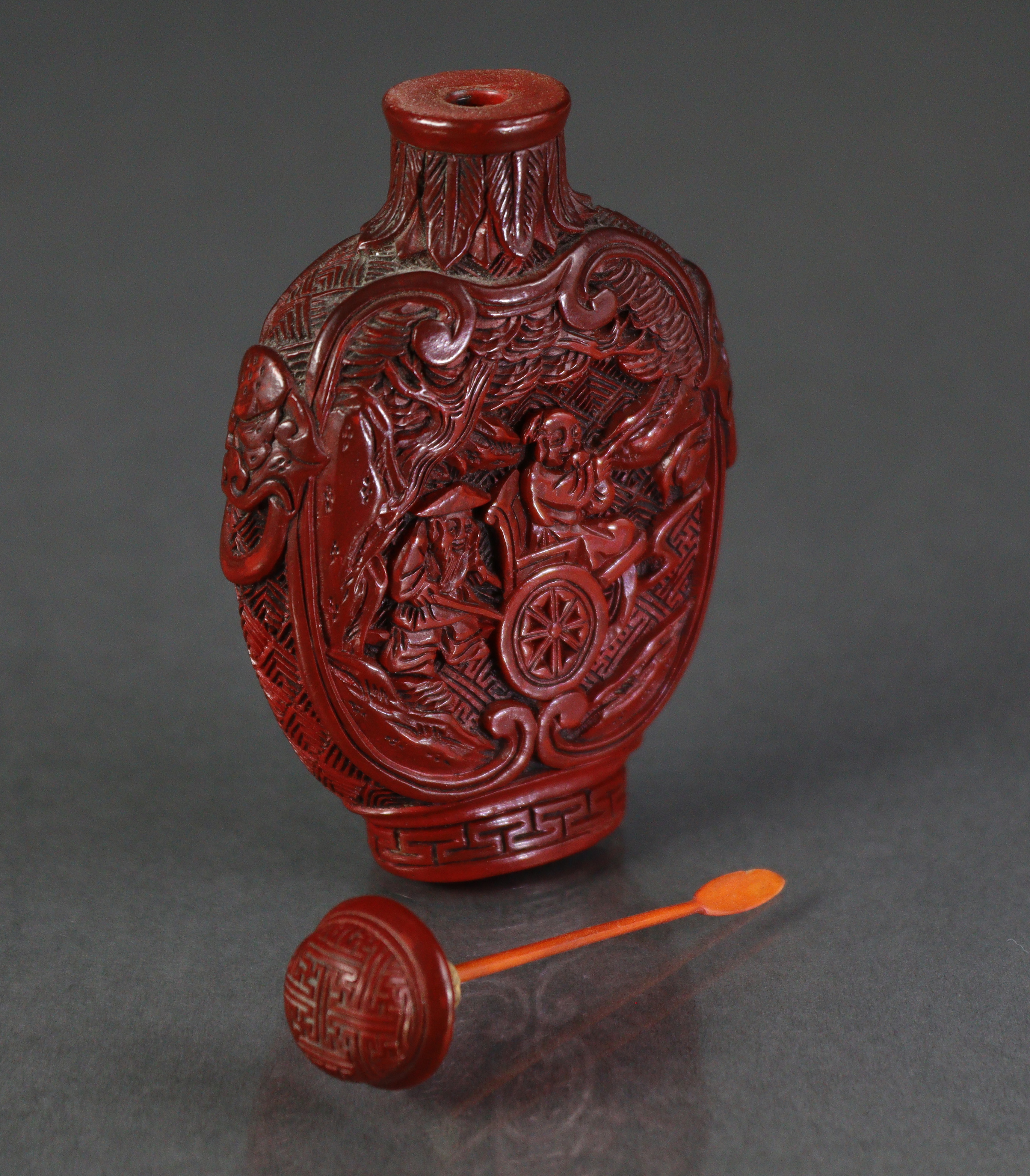 A Chinese cinnabar lacquer large snuff bottle of ovoid form, with flat sides, each carved with a - Image 5 of 7