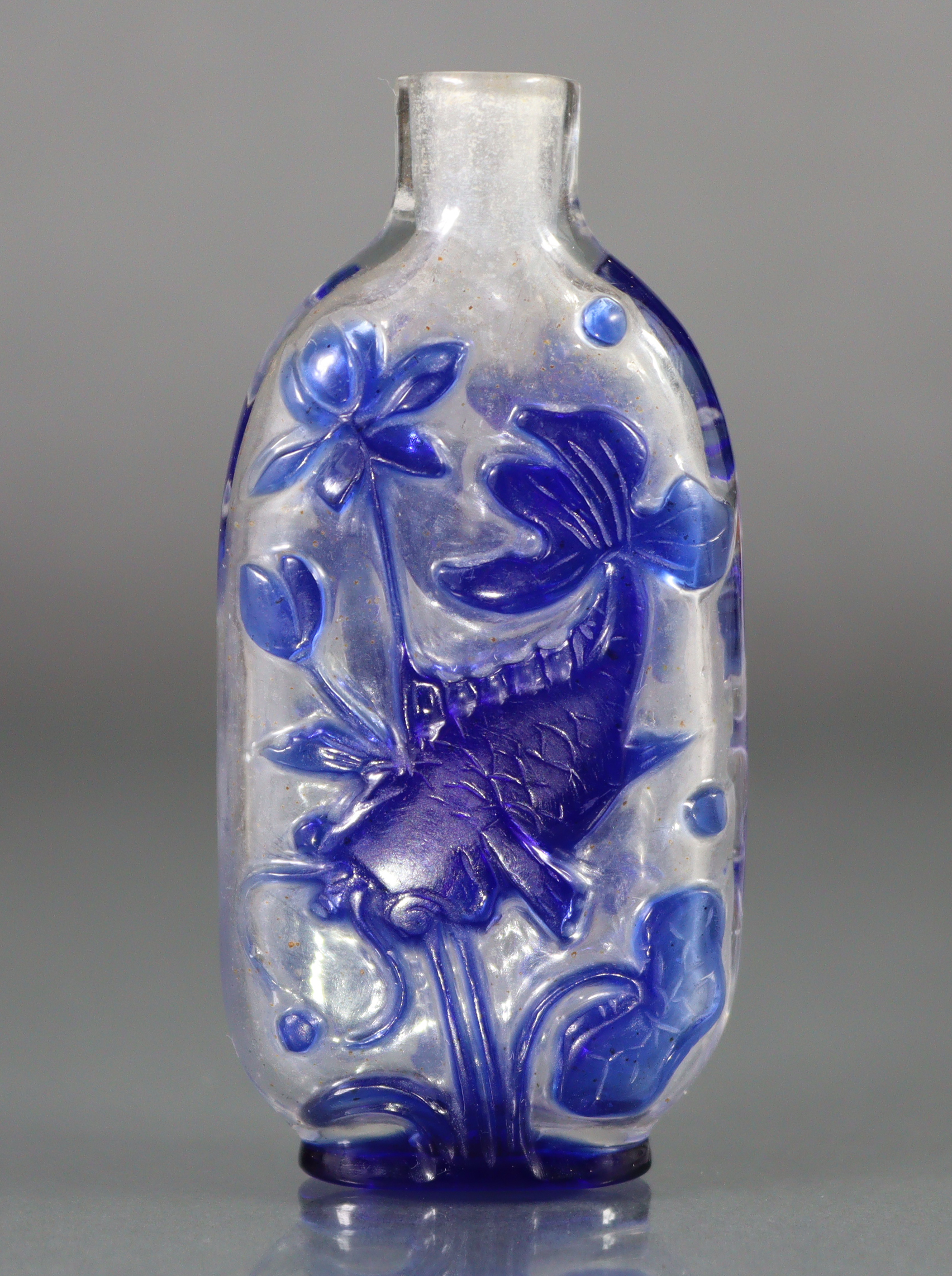 A Chinese blue overlay clear glass snuff bottle of flat-sided rectangular form, each side