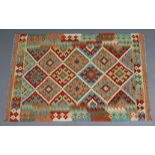 A vegetable dye choli kelim rug of ivory ground with multicoloured repeating geometric design to the