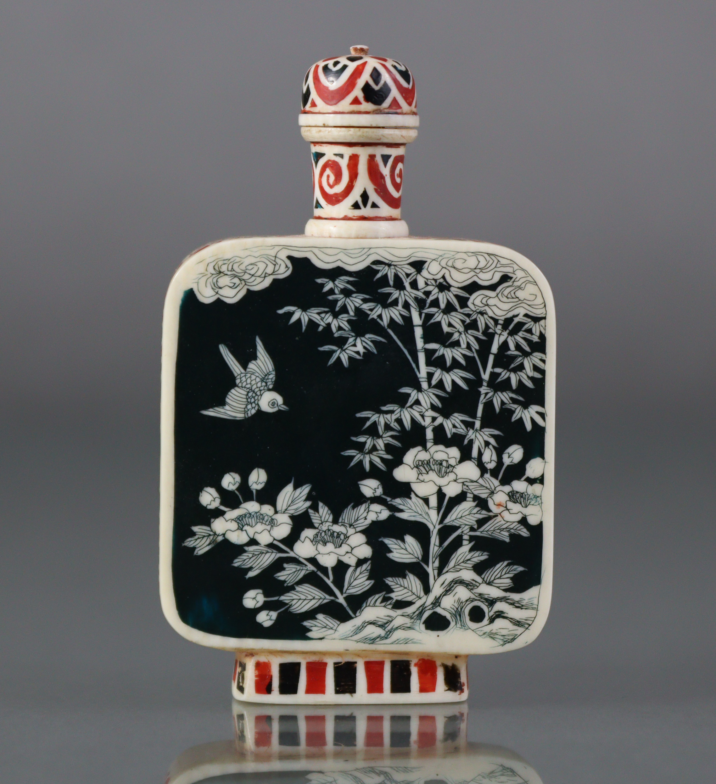 A Chinese stained ivory snuff bottle of flat-sided rectangular form, each side decorated with - Image 2 of 6