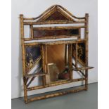 A late Victorian bamboo frame rectangular wall mirror inset painted lacquer panels & with an