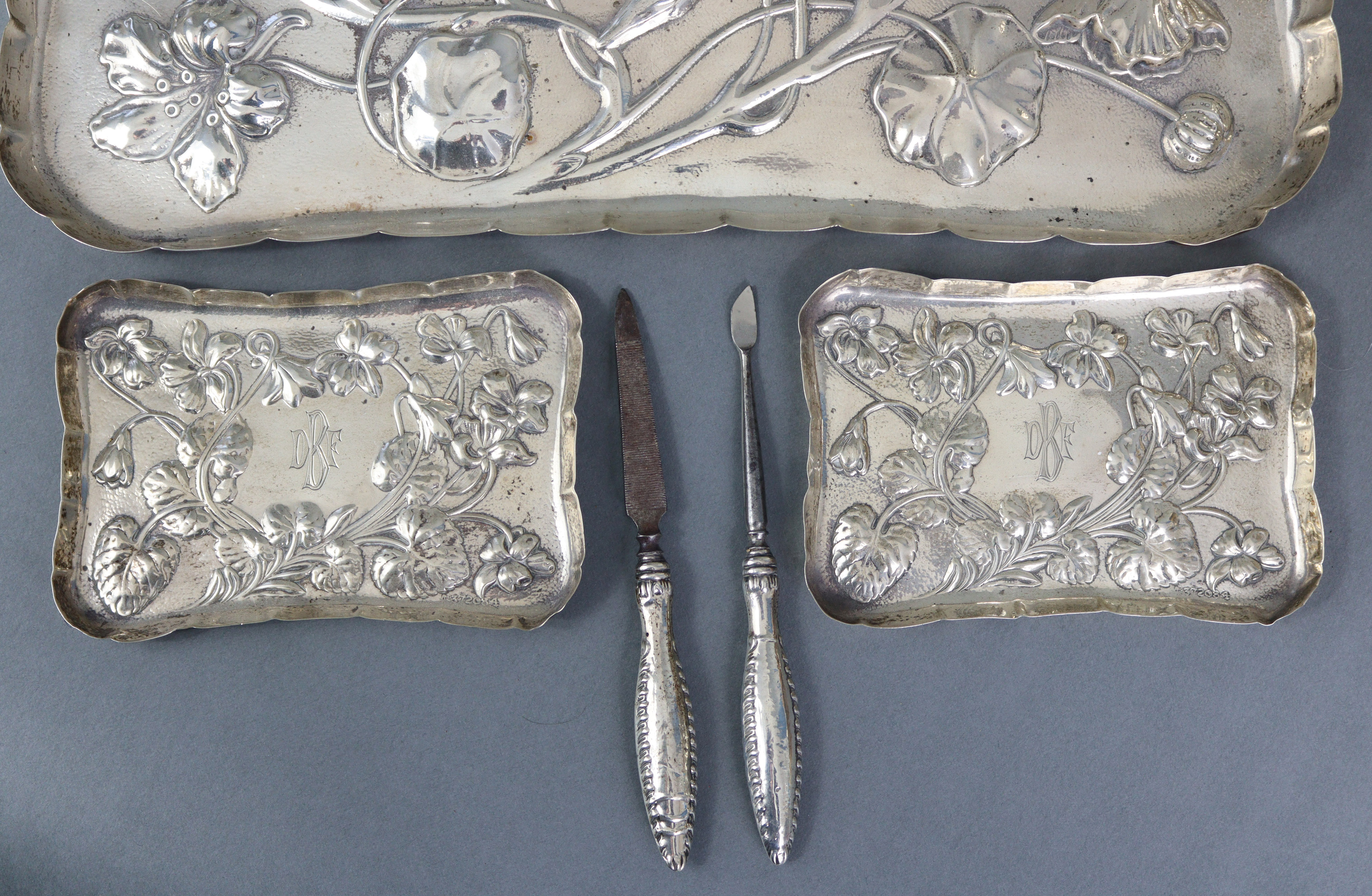 An Edwardian silver dressing table tray with raised crimped border, embossed decoration of - Image 3 of 9