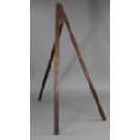 A 19th century mahogany folding tripod easel. 73¾” high x 6” wide (when closed).