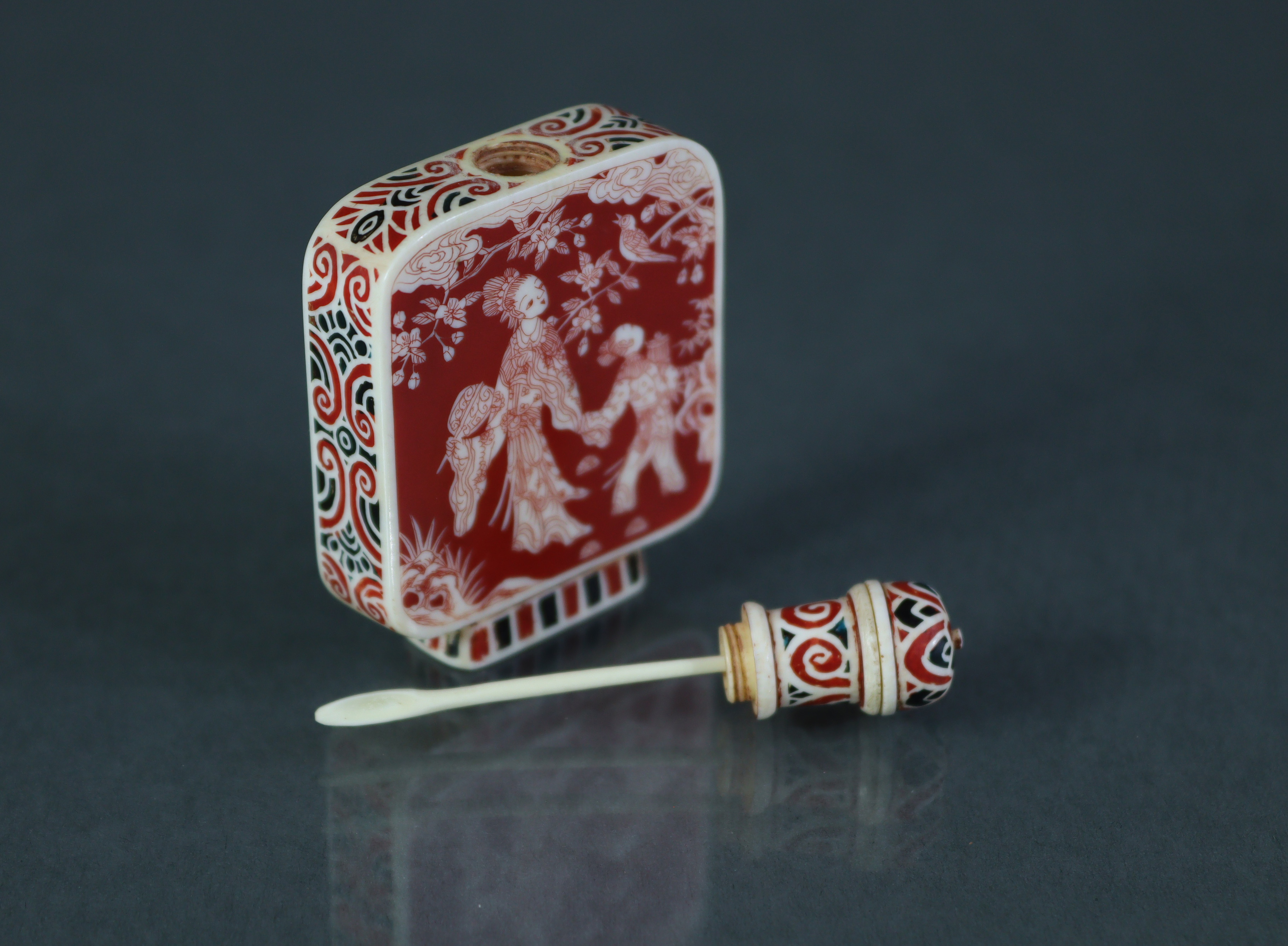 A Chinese stained ivory snuff bottle of flat-sided rectangular form, each side decorated with - Image 6 of 6