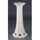 A Bretby Pottery white painted jardiniere stand of hexagonal tapered form with stylised Art
