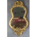 A 19th century giltwood & gesso kidney-shaped girandole, inset later bevelled mirror plate,