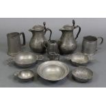Two late 18th/early 19th century baluster shaped pewter jugs, 9” & 7¾” high; two pewter