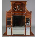 A Victorian mahogany frame overmantel mirror with broken-arch pediment, turned supports & carved