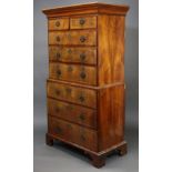 An 18th century walnut veneered chest-on-chest with moulded cornice, fitted two short & three long