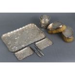 An Edwardian silver dressing table tray with raised crimped border, embossed decoration of