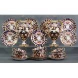 A pair of 19th century Davenport porcelain Imari pattern two-handled ovoid vases, each on round