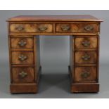 An 18th century mahogany pedestal desk of small proportions, moulded edge to the gilt-tooled crimson