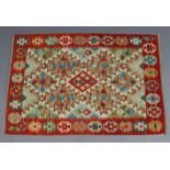 A vegetable dye Choli kelim rug of ivory ground with multi-coloured geometric design to the centre