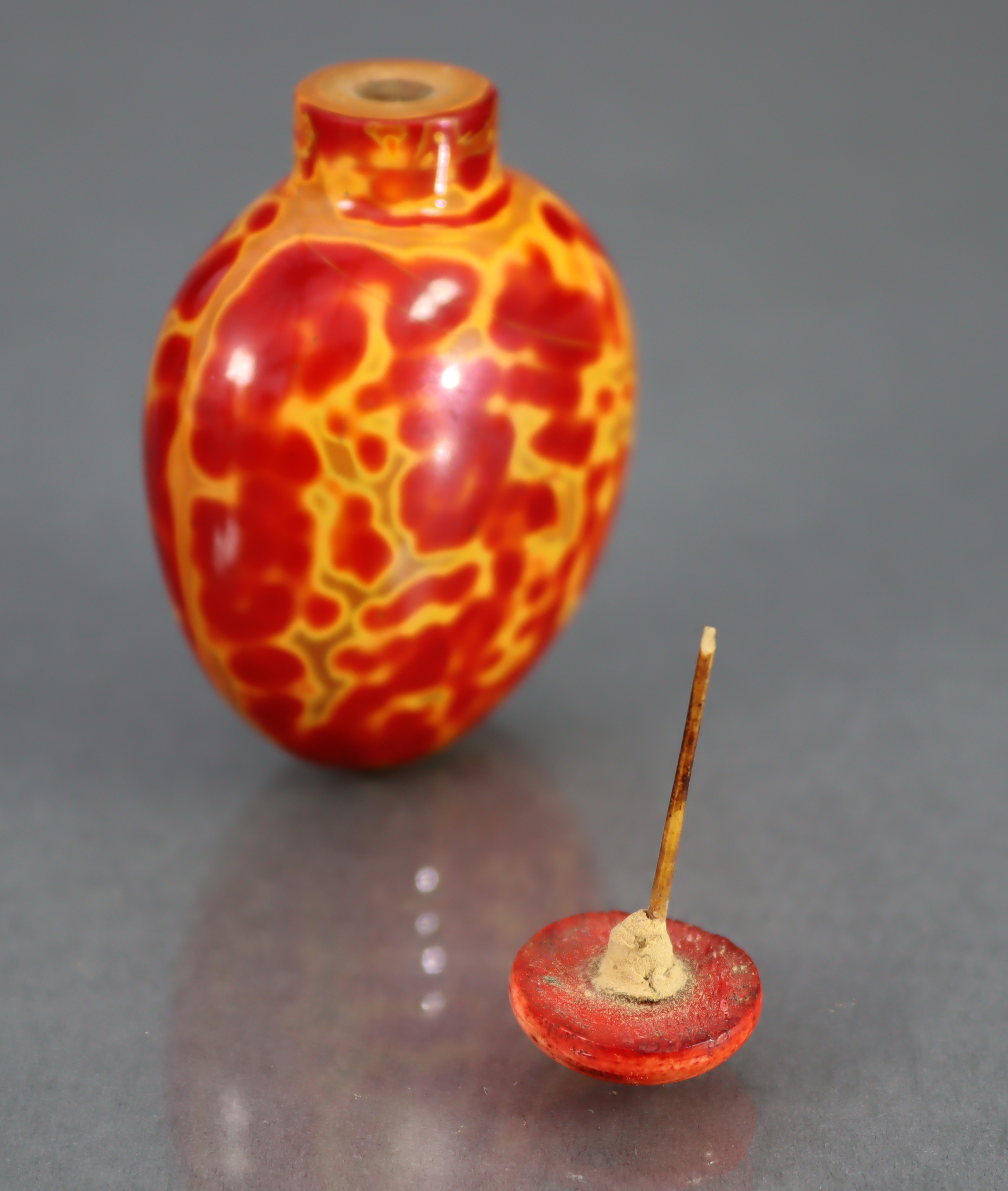 A CHINESE 'REALGAR' GLASS SNUFF BOTTLE, of rounded ovoid form & bright red & yellow colour, 2¼” high - Image 9 of 10