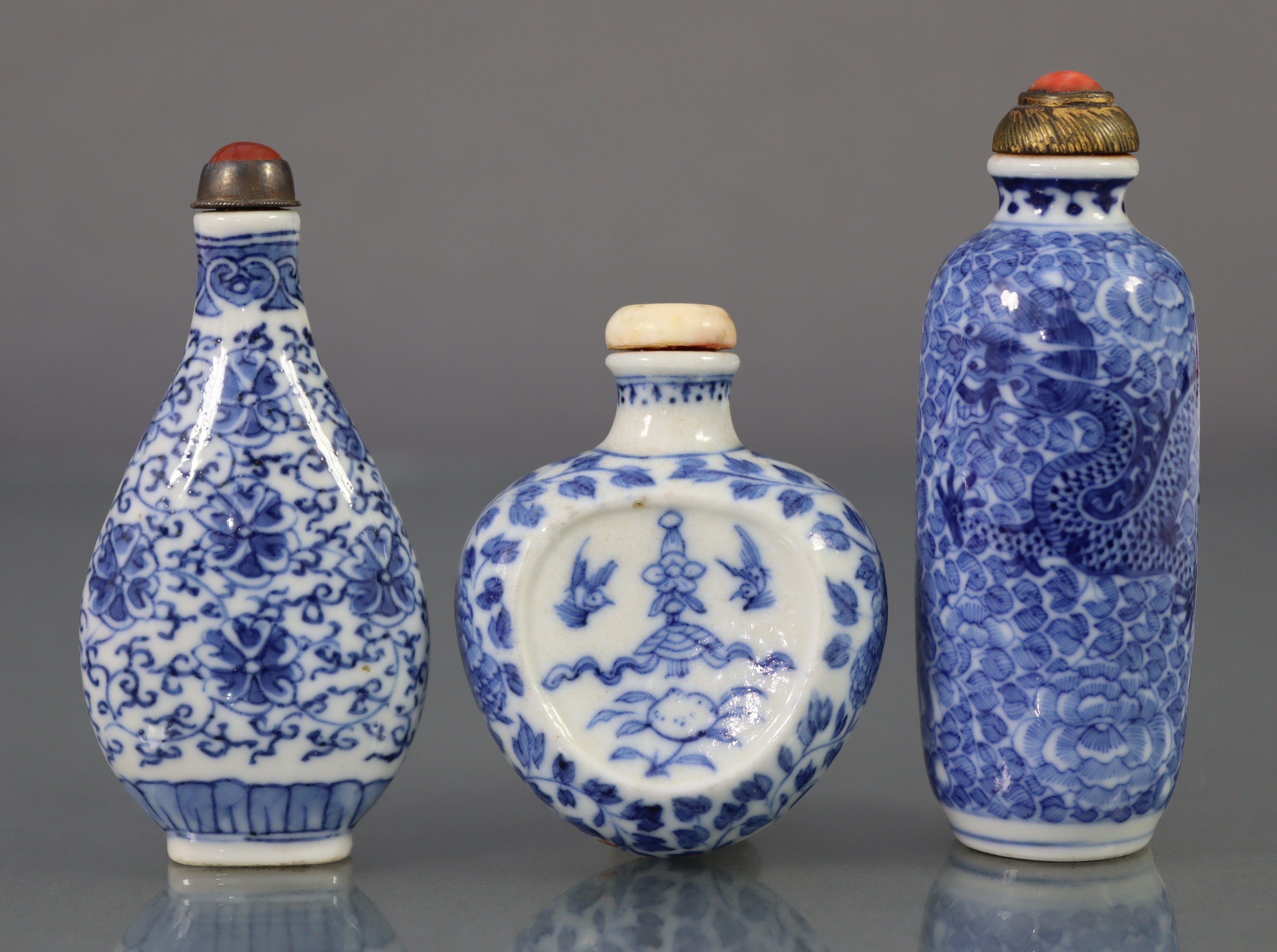 Three Chinese blue & white porcelain snuff bottles, comprising a peach form flat-sided bottle,