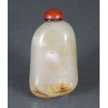 A CHINESE CELADON JADE PEBBLE-FORM SNUFF BOTTLE, with russet & white striations, with hardstone