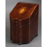 A George III inlaid mahogany knife box, with serpentine front, the sloping hinged lid with