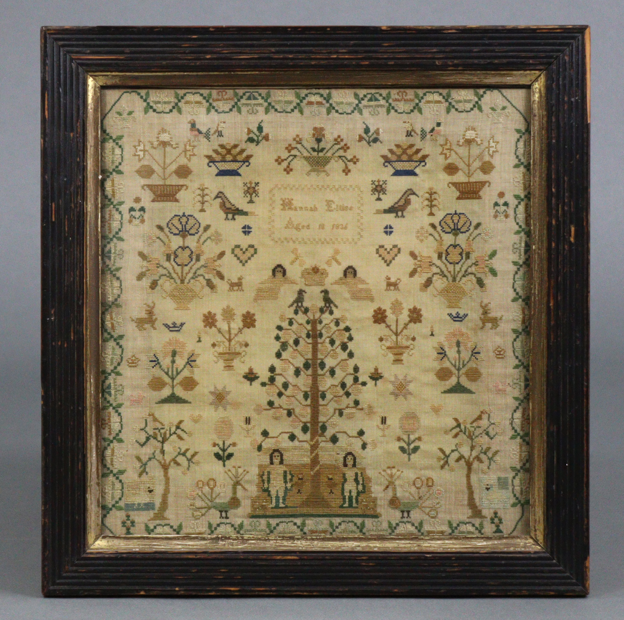 A William IV silk needlework sampler worked by Hannah Ellis, Aged 10, dated 1836, with Adam & Eve,