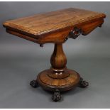 A William IV rosewood card table with moulded edge to the rectangular fold-over top, with circular