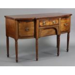 A regency mahogany crossbanded & line-inlaid bow-front sideboard, fitted frieze drawer flanked by