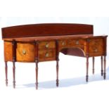 A GEORGE III FIGURED MAHOGANY SIDEBOARD IN THE MANNER OF GILLOWS, crossbanded & line-inlaid, the inv