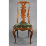 An early 18th century walnut side chair, with shaped splat-back above a serpentine shaped drop-in