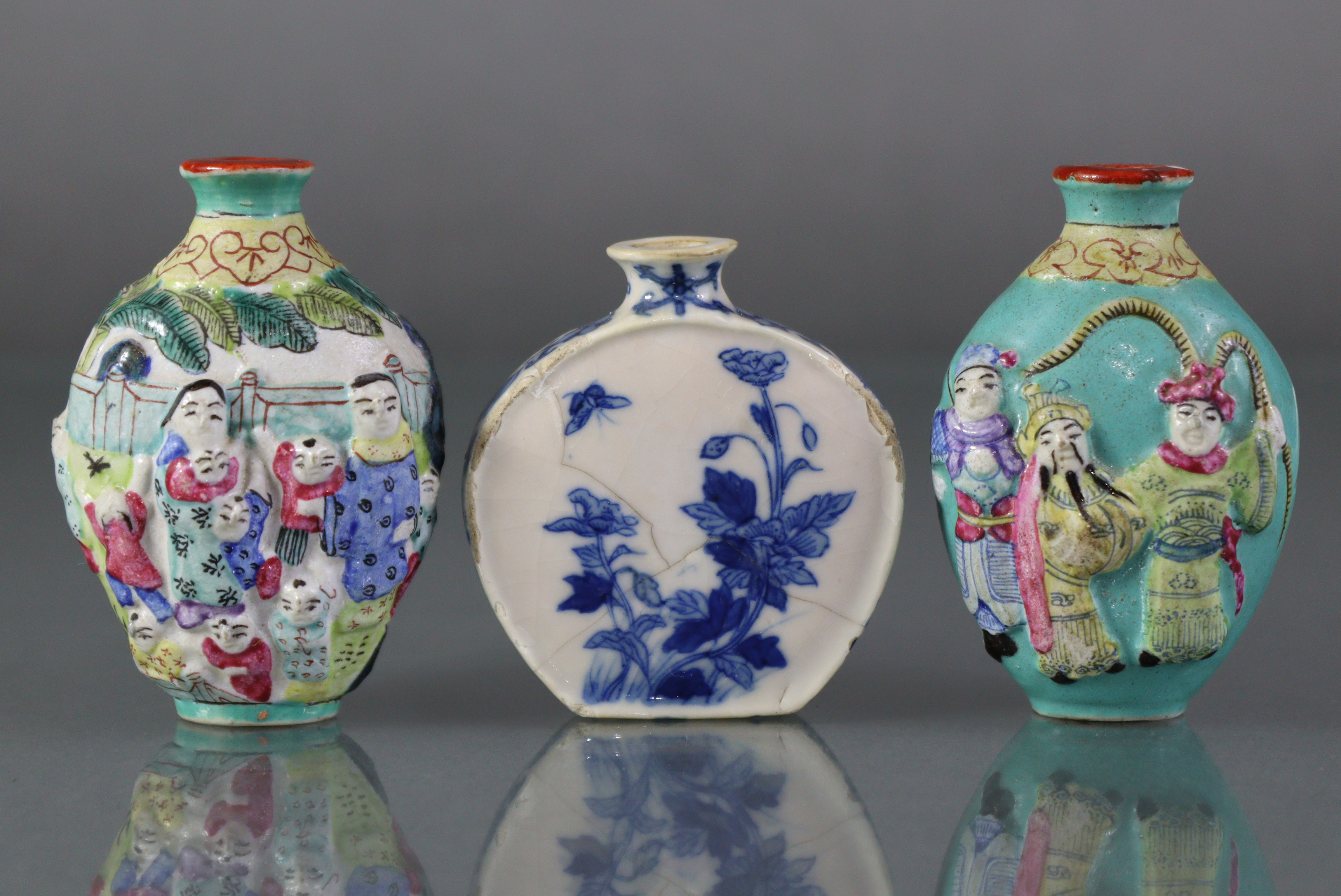 Two Chinese famille rose porcelain snuff bottles of ovoid form, each with figure scene decoration,