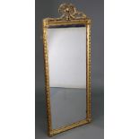 A late 19th/early 20th century gilt frame rectangular wall mirror with carved giltwood ribbon-bow