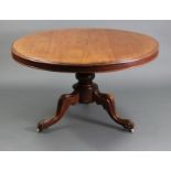 A Victorian mahogany tilt-top pedestal dining table, with moulded edge to the circular top, on