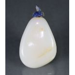 A CHINESE WHITE JADE PEBBLE-FORM SNUFF BOTTLE of an even pale tone with russet coloured