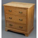 A late Victorian walnut small chest fitted three long graduated drawers with brass swing