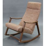 A teak frame rocking chair with padded seat & back upholstered brown material, & on square supports;