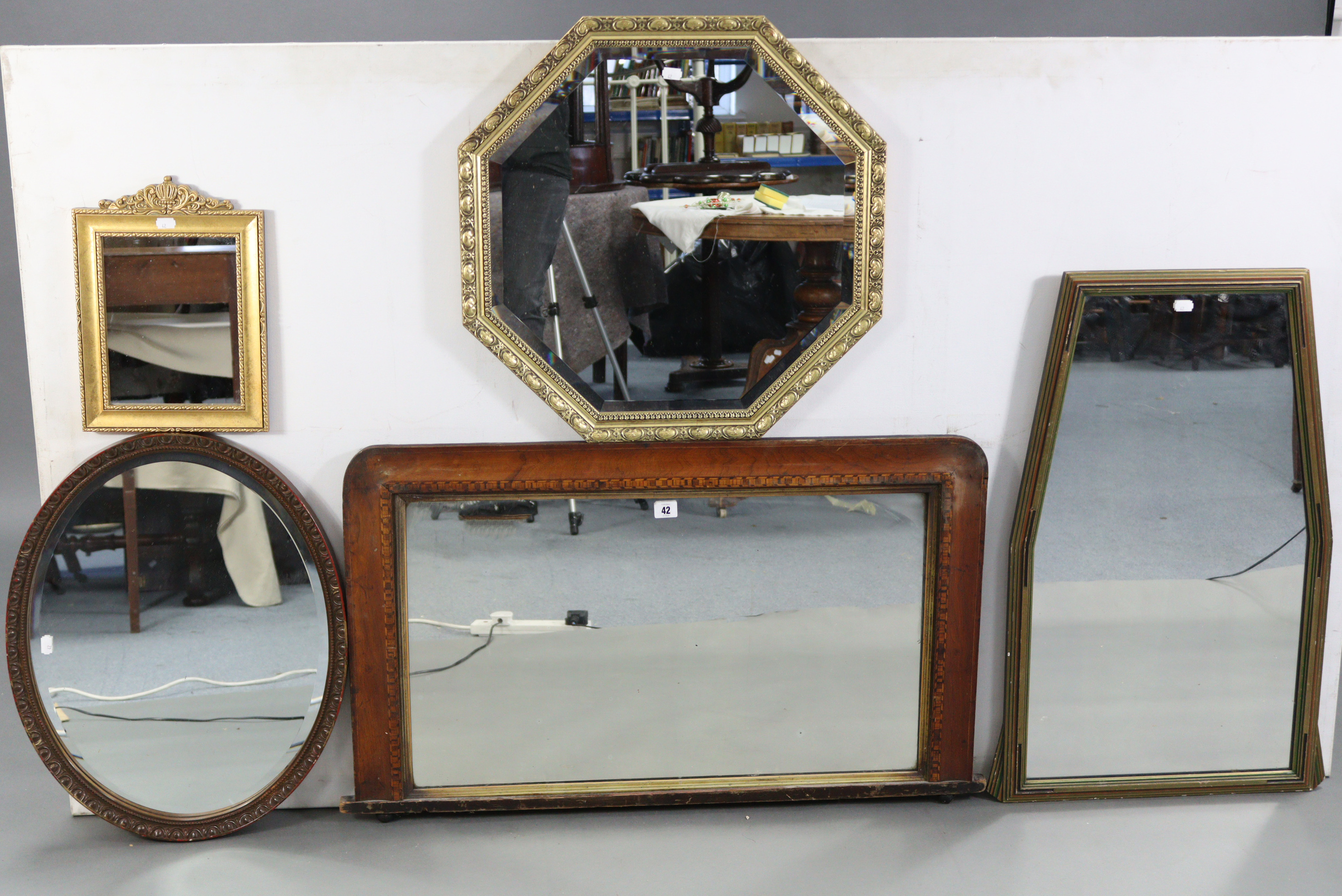 A cottage overmantel mirror in inlaid-beech frame, 36” x 21½”; together with five other mirrors.