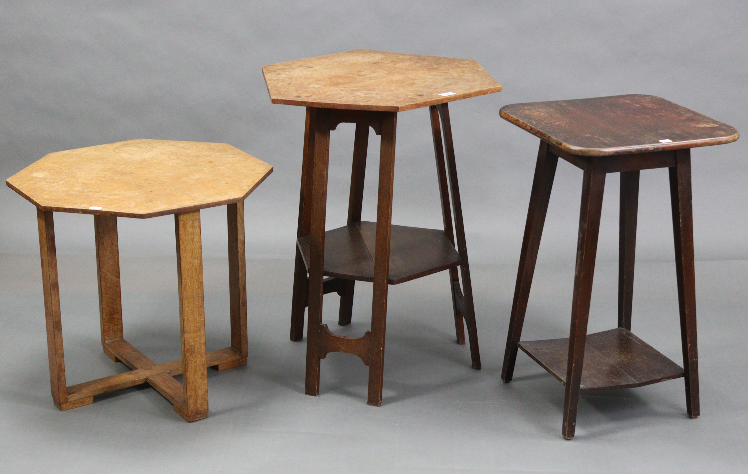 An Edwardian oak occasional table with six-sided top, & on three shaped supports, 22½” wide x 27”