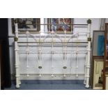 A late Victorian-style white painted iron & brass double bedstead, 55½” wide, complete with side
