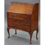 A walnut bureau, with fitted interior enclosed by fall-front above three long graduated drawers, &
