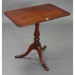 A 19th century mahogany tripod table with rounded corners to the rectangular tilt-top, & on vase-